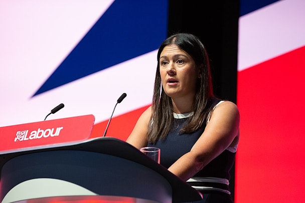 Lisa Nandy stadning before a Union Jack at a Labour event