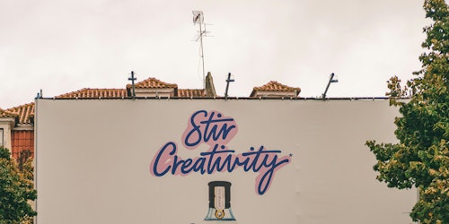 The message on the top half of a billboard reads 'sitr creativity'