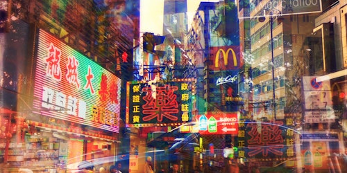 A merged streetscape of neon signs showing brands and Asian writing