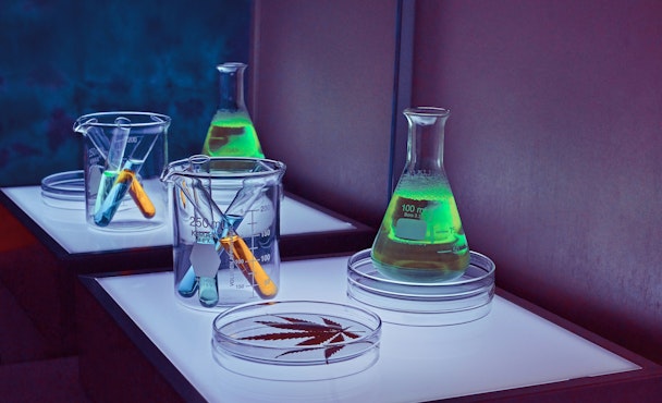 A set of science equipment lit up with green, blue and purple lights