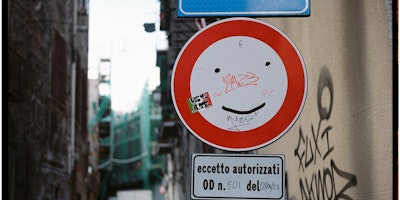 Smiley face on a road sign