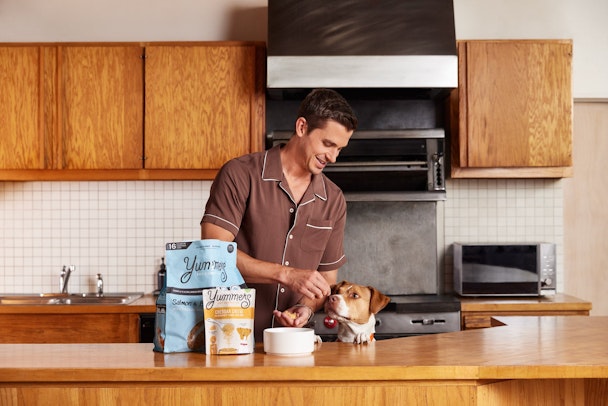 Antoni Porowski feeding his dog