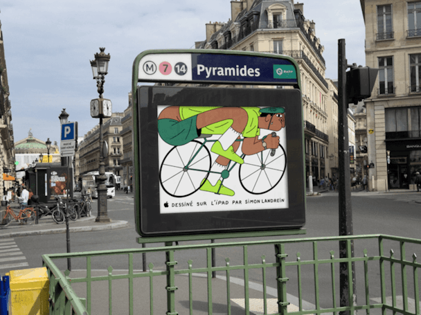 Illustration of a cyclist, created on an iPad, on an ad hoarding at the entrance of a Paris Metro station