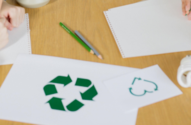 Recycling logo on a piece of paper