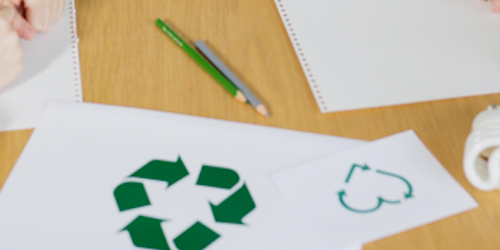 Recycling logo on a piece of paper