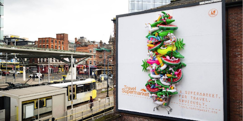 Billboard filled with inflatable pool toys in a shopping trolley