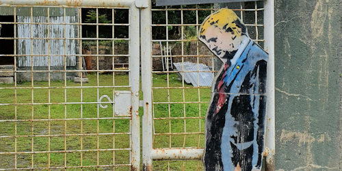 Artwork of Trump on a fence