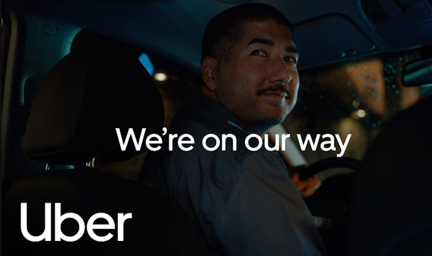 Uber driver with the words 'On our way' on top 