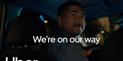 Uber driver with the words 'On our way' on top 